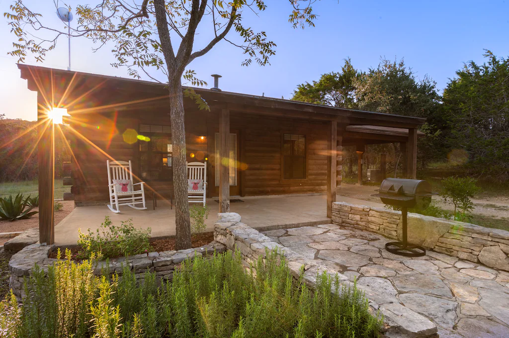 Cabin's front view with a matching sunset.