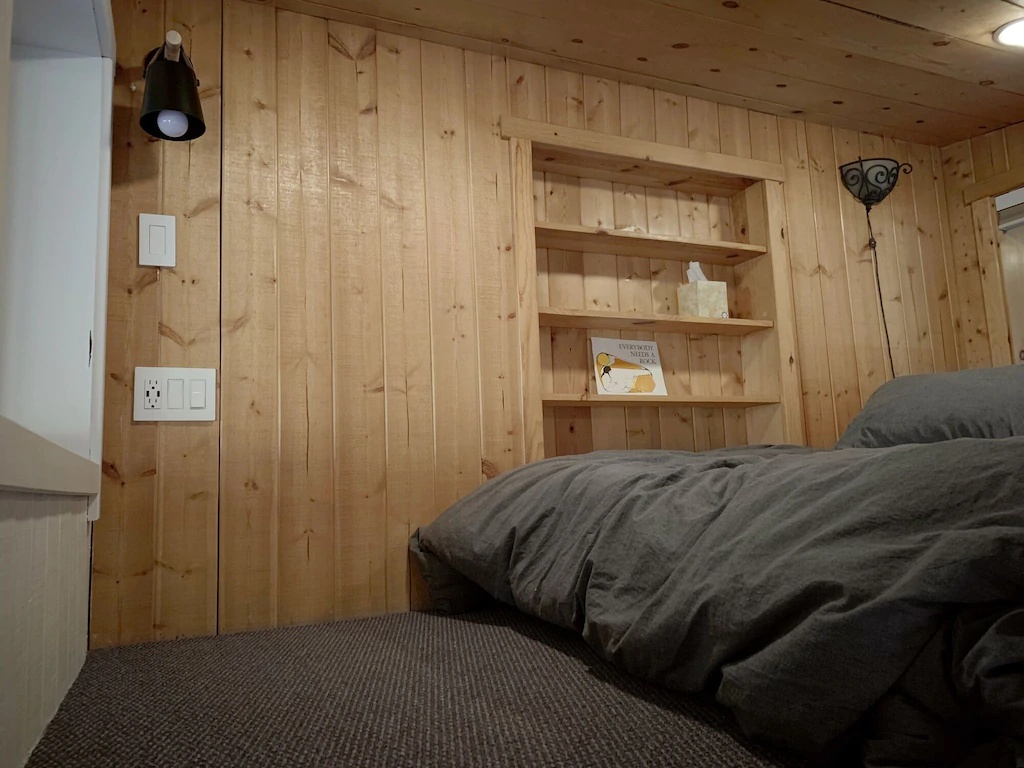 Built-in shelves, reading light, and integrated USB-charging ports in the loft.