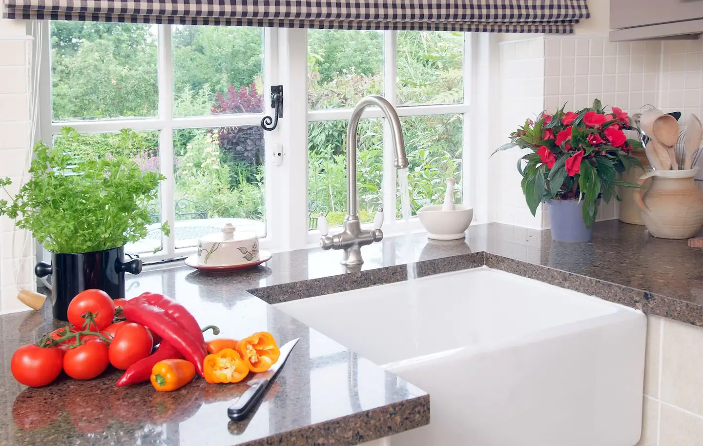 While cleaning the dishes, look out over the walled garden.