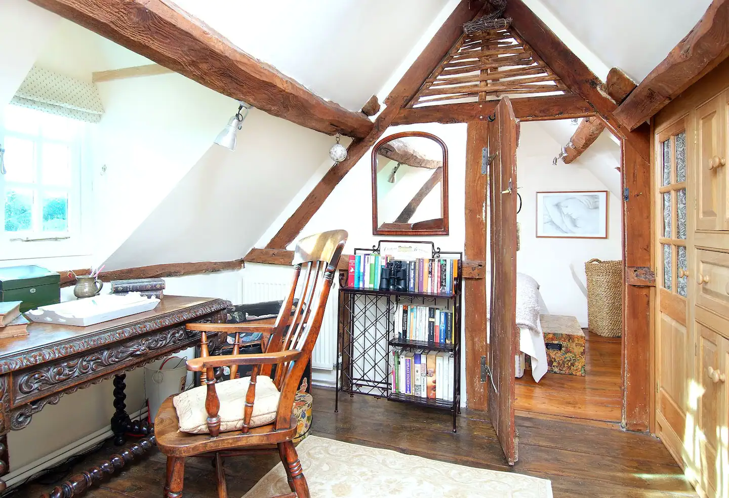 A view of the bedroom from the study, with a portion of the fitted closet on the right.