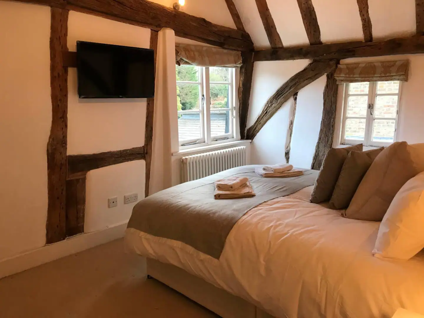 The main bedroom has a flat-screen television.