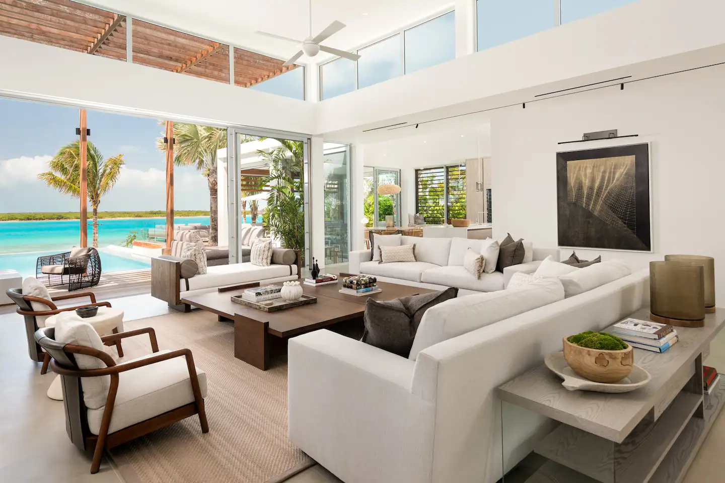 Elegant sofas and armchairs are arranged around the coffee table, creating a sophisticated and inviting atmosphere.