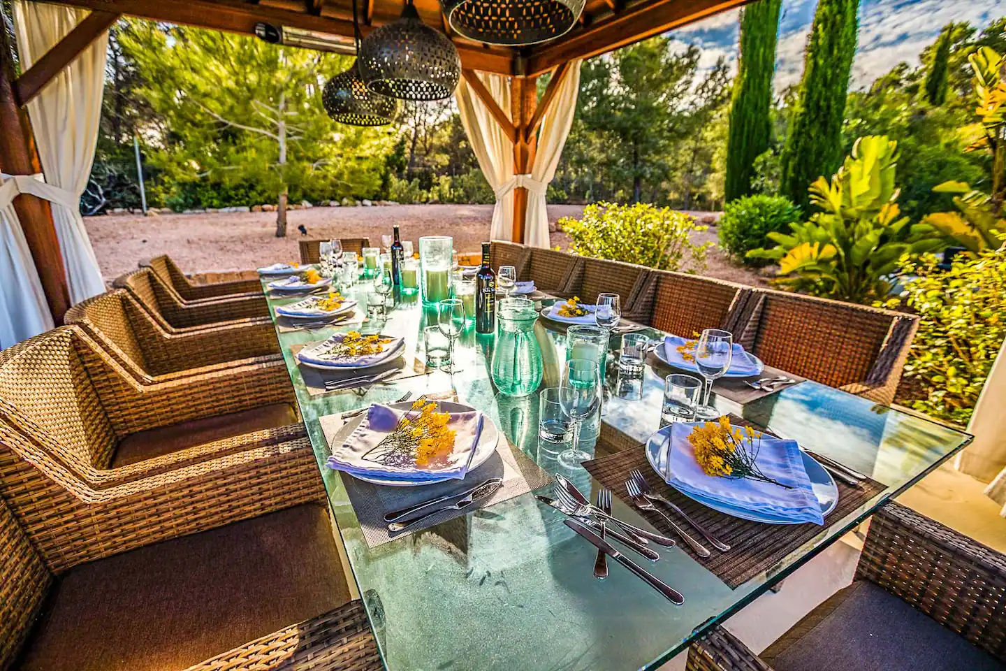 An inviting outdoor patio with comfortable seating, a cozy fire pit, and an enchanting garden backdrop.